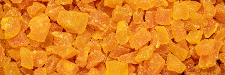 background and texture of dried mango fruit diced, panoramic web banner
