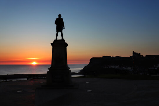 Sunrise Near Captain James Cook In Whitby, Yorkshire, UK