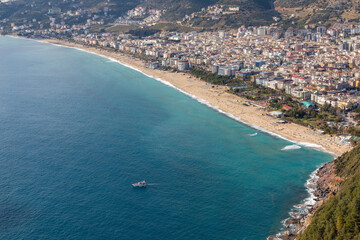 Fototapeta premium High angle aerial view of Cleopatra Beach during the coronavirus pandemic days in Alanya, Antalya, Turkey in 2021.