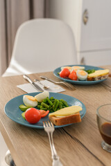 Still life healthy breakfast with nobody. Fresh bio vegetables and sandwich on a plate