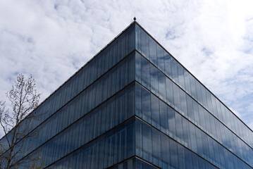 Fototapeta na wymiar Modern office building with glass facade at City of Opfikon. Photo taken April 30th, 2021, Opfikon, Switzerland. 