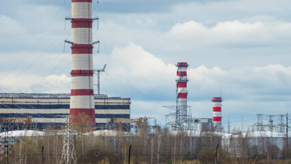 Fototapeta na wymiar Panoramic view of power station Lukomlskaya Gres. Chimneys with smoke of power plant. Ecological problem. Environmental pollution concept.