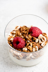 Healthy breakfast oatmeal granola with fresh raspberries