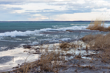 Thawing lake shoreline in spring