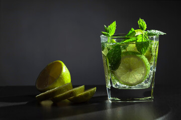 Cold carbonated drink with lime and mint.
