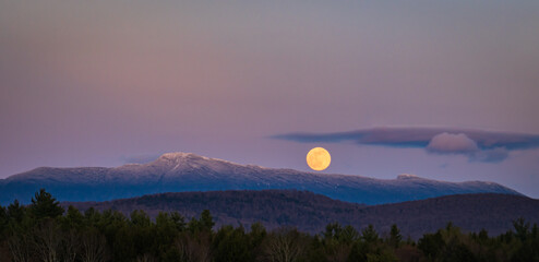 super moon rising over Mount Mansfield in the Green Mountains of Vermont
