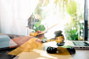 Business and lawyers discussing contract papers with brass scale on desk in office. Law, legal services, advice, justice and law concept