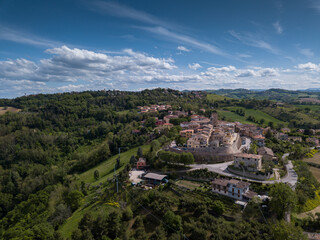 Italy, May 2021: aerial view of the medieval village of Sant'angelo in Lizzola in the province of Pesaro and Urbino in the Marche region. Around the hills of the Marche