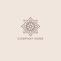 An Asian, stylized symbol or logo of the lotus flower, consisting of several elements. Made with a curved thin contour line.