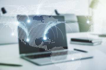 Double exposure of abstract digital world map with connections on laptop background, research and strategy concept