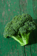 Green cauliflower broccoli inflorescence on bright sunbeam on summer day freshly cut. Garden eco vegetables harvest