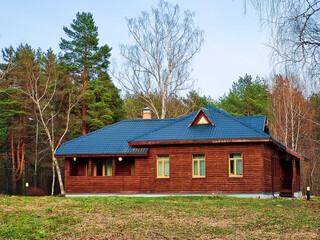 Eco-friendly wooden house in forest. Modern sustainable construction. Lifestyle and environmental protection.