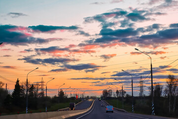 Fototapeta na wymiar Highway at sunset. View of asphalt road from the car window.