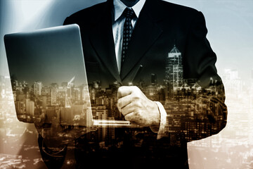 Business man action against candle stick graph chart of stock market investment trading, monotone...