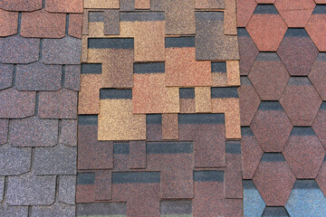 Backdrop made of sets of flexible roofing material. Graphic diamond shape and square.