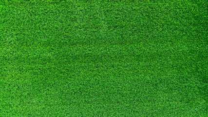 Green grass background field area It is a grass that looks short, cut evenly, making it suitable for wallpapering in design. And graphics