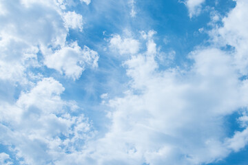 Blue sky and white clouds. Clouds texture. Nice sunny sky. A positive picture