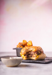 Bitten Cheese Burger with fries