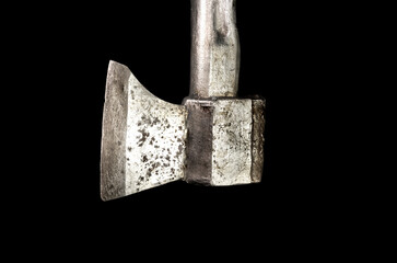 Old silver ax with a metal handle. Isolated on black background