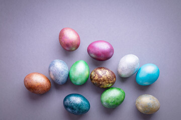 Colorful Easter eggs. Easter background. Minimalistic Easter concept on gray background. Card with copy space for text.