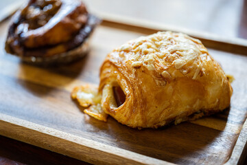 Croissant Roll with Ham Cheese on a Wooden Tray