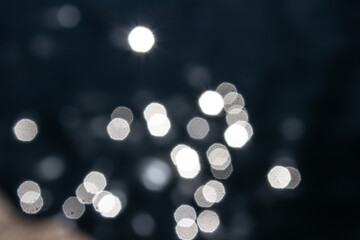 Abstract bokeh light in water.World Water Day Sea surface blink bokeh