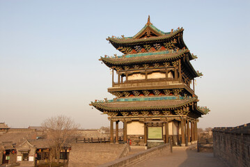 Pingyao in Shanxi Province, China. The South Gate tower of Pingyao city wall seen in the evening sun.