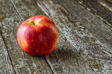 Green and red apples on blackboard or chalkboard background. Bright fruit composition.Red and green apple on old wooden table. Top view with space for your text
