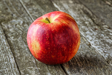 Green and red apples on blackboard or chalkboard background. Bright fruit composition.Red and green apple on old wooden table. Top view with space for your text