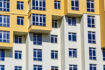 PVC windows on facade of skyscraper. Plastic double glazed windows.Textura of modern buildings, glazed financial and residential surfaces.Building exterior.
