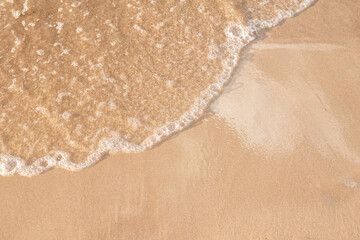 Fototapeta na wymiar foamy sea water on the beach, golden sand, , sun