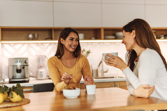 Laughing, having good time.