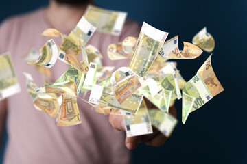euro bills flying around  in hand