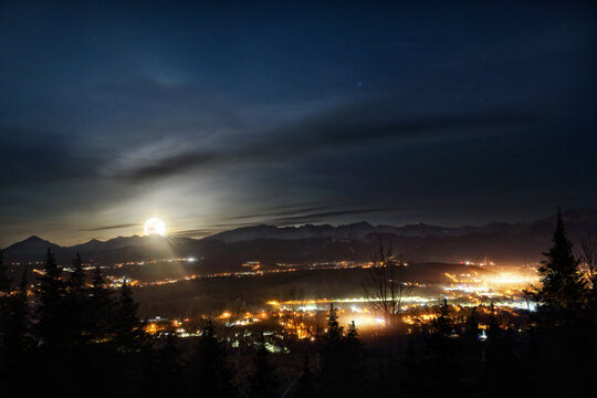 view of a moonlit night in Zakopane city