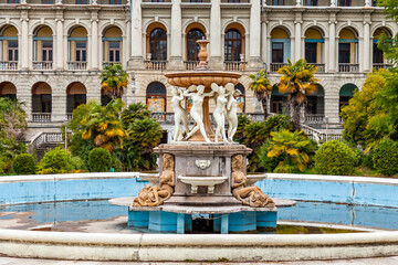 Naklejka premium Sochi, Russia, April 13, 2021. Fragment of the facade of the main building of the abandoned Ordzhonikidze sanatorium, historical and cultural landmark. Fountain 