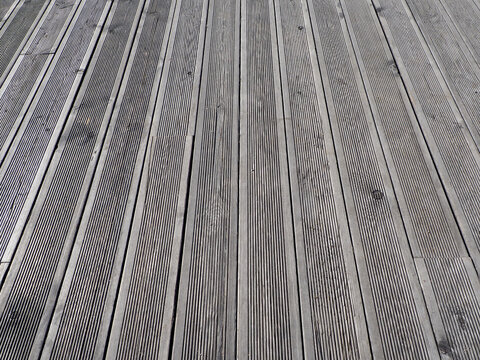 terraced wooden gray board with a longitudinal relief pattern, texture