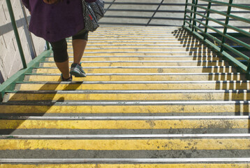 Lady walkinf down a flight of stairs