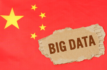 Against the background of the Chinese flag lies cardboard with the inscription - BIG DATA