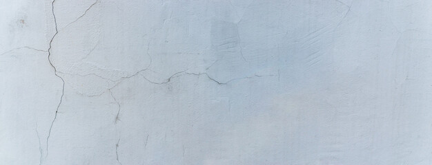 Panoramic scenery with  gray plaster wall and cracks
