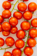 small red cherry tomatoes on white background. Red tomatoes for pasta or salad	
