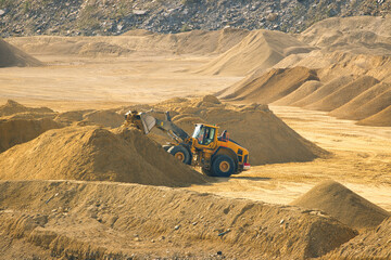 A Large Wheel Loader working in a Huge Quarry. England, UK.