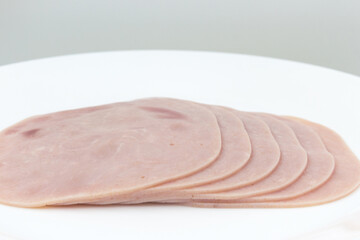 Close-up, background of raw ham,  sliced, stack