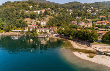 Fototapeta na wymiar Aerial view of little village Colmegna on the coast of lake Maggiore, municipality of Luino, Lombardy, Italy 
