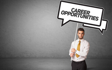 business person in casual holding road sign