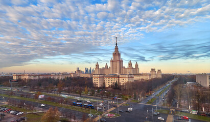 Fototapeta na wymiar Aerial panoramic view of sunset campus buildings of famous Moscow university under dramatic cloudy sky in spring
