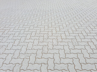Interlocking concrete paver tiles in clean perspective view. - Powered by Adobe