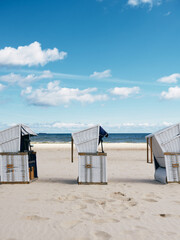 beach baskets for sunbathing on the sand by the sea,