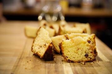 pieces of cupcake lie on a wooden cutting board, background blurred, selective focus. High quality photo
