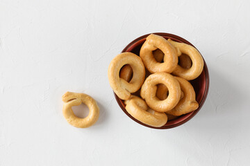 Taralli - traditional Italian bread or salted biscuits from Apulia (Italy) in a bowl on the table