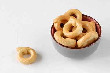 Taralli - traditional Italian bread or salted biscuits from Apulia (Italy) in a bowl on the table